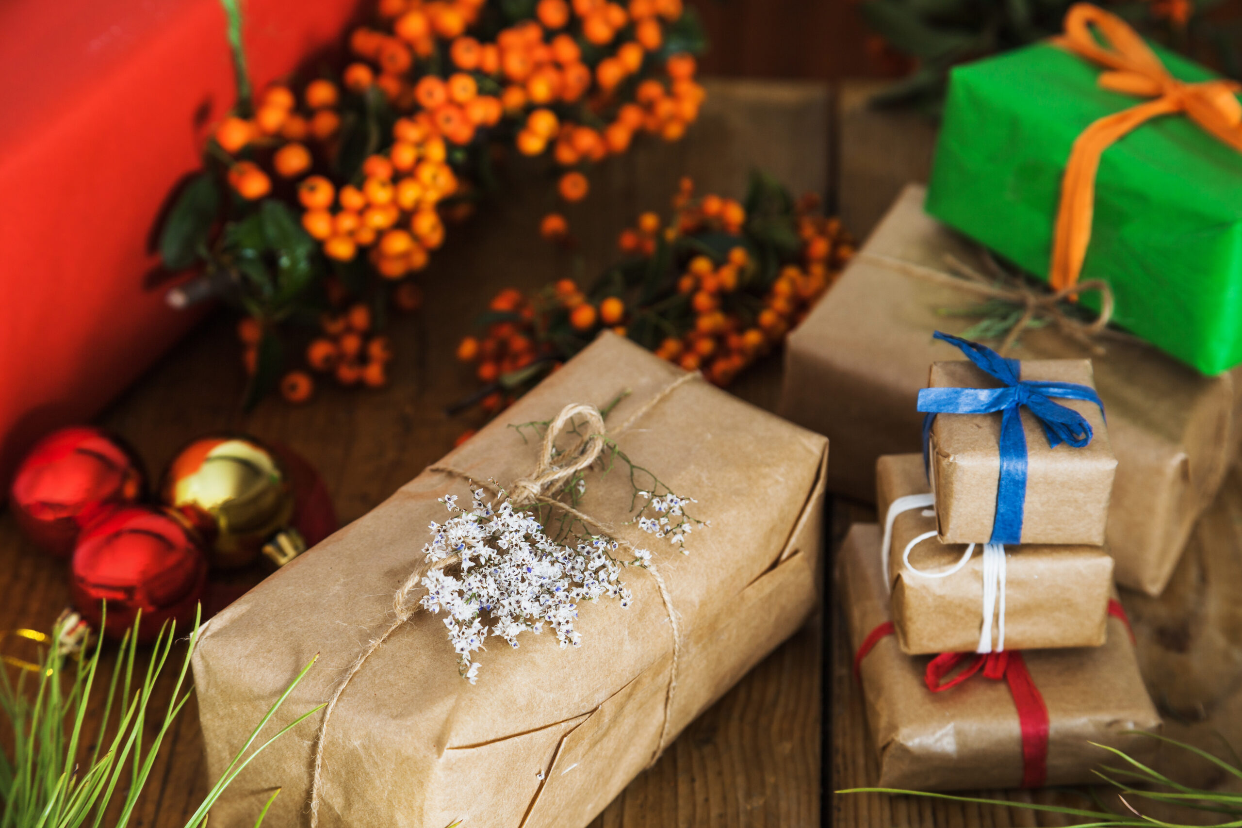 A beautifully wrapped custom Christmas gift box with a festive holiday background.